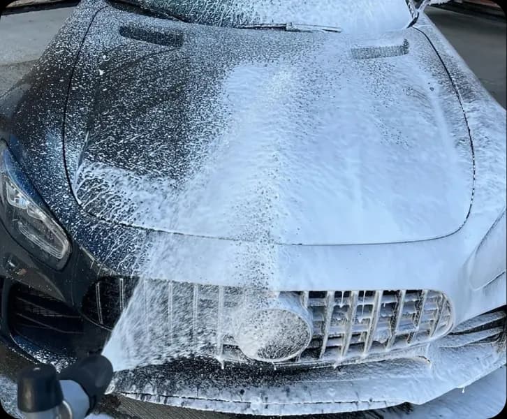 Car covered in wash foam