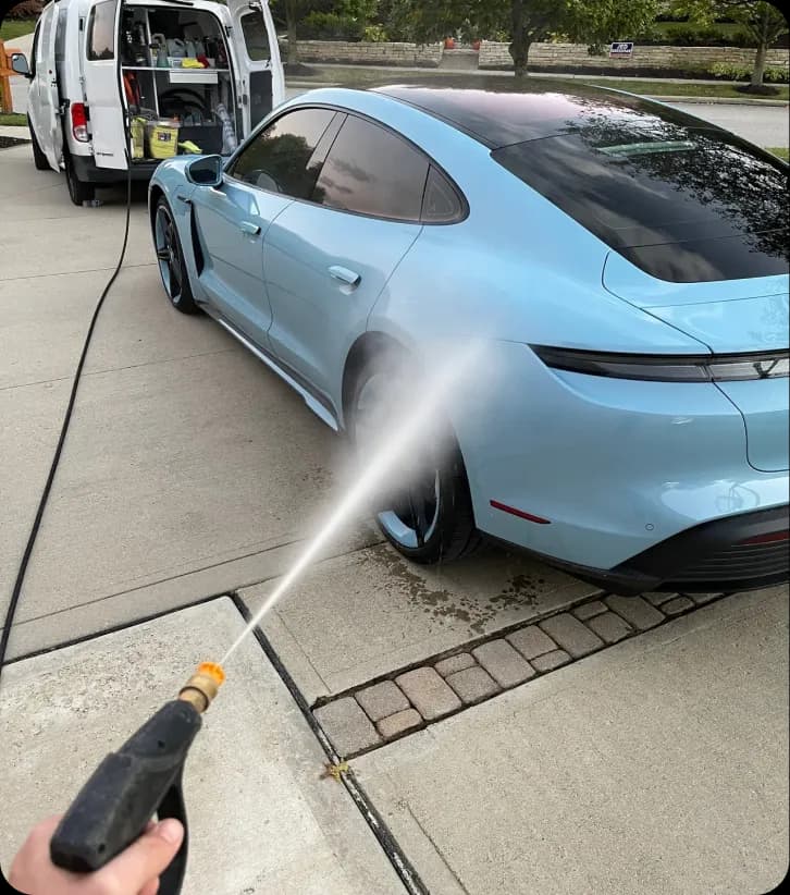 Porsche Taycan being hand washed